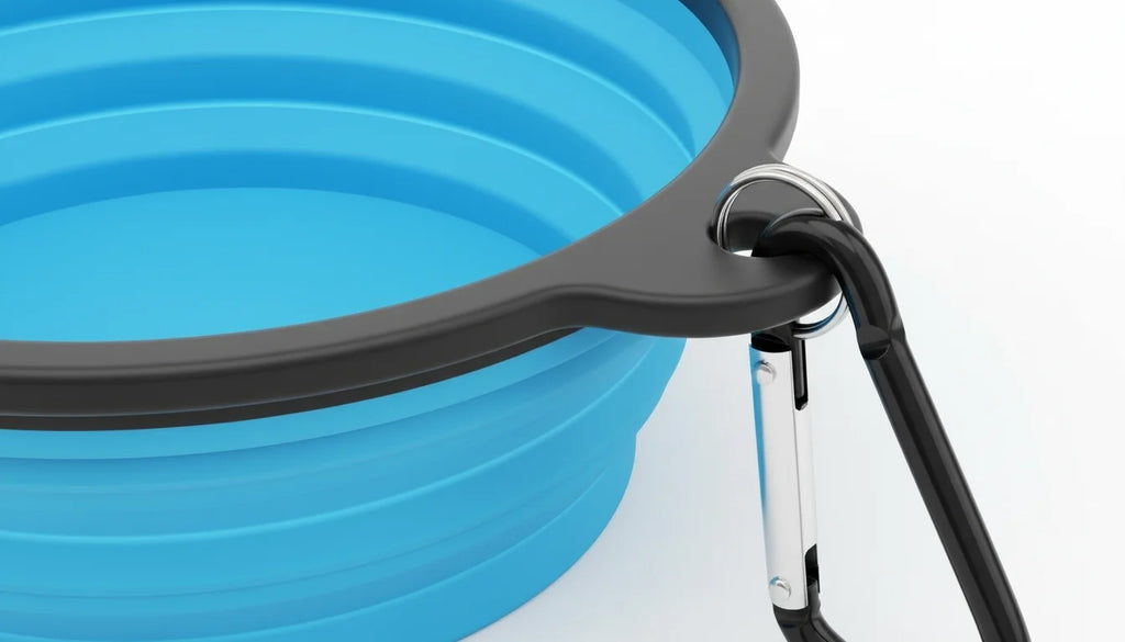A bright blue collapsible pet bowl with a black carabiner clip attached to its rim