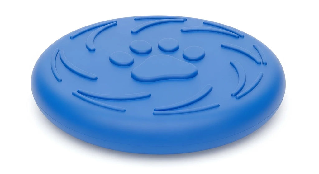 A blue, round, rubber pet treat dispenser with a paw print design and curved ridges.
