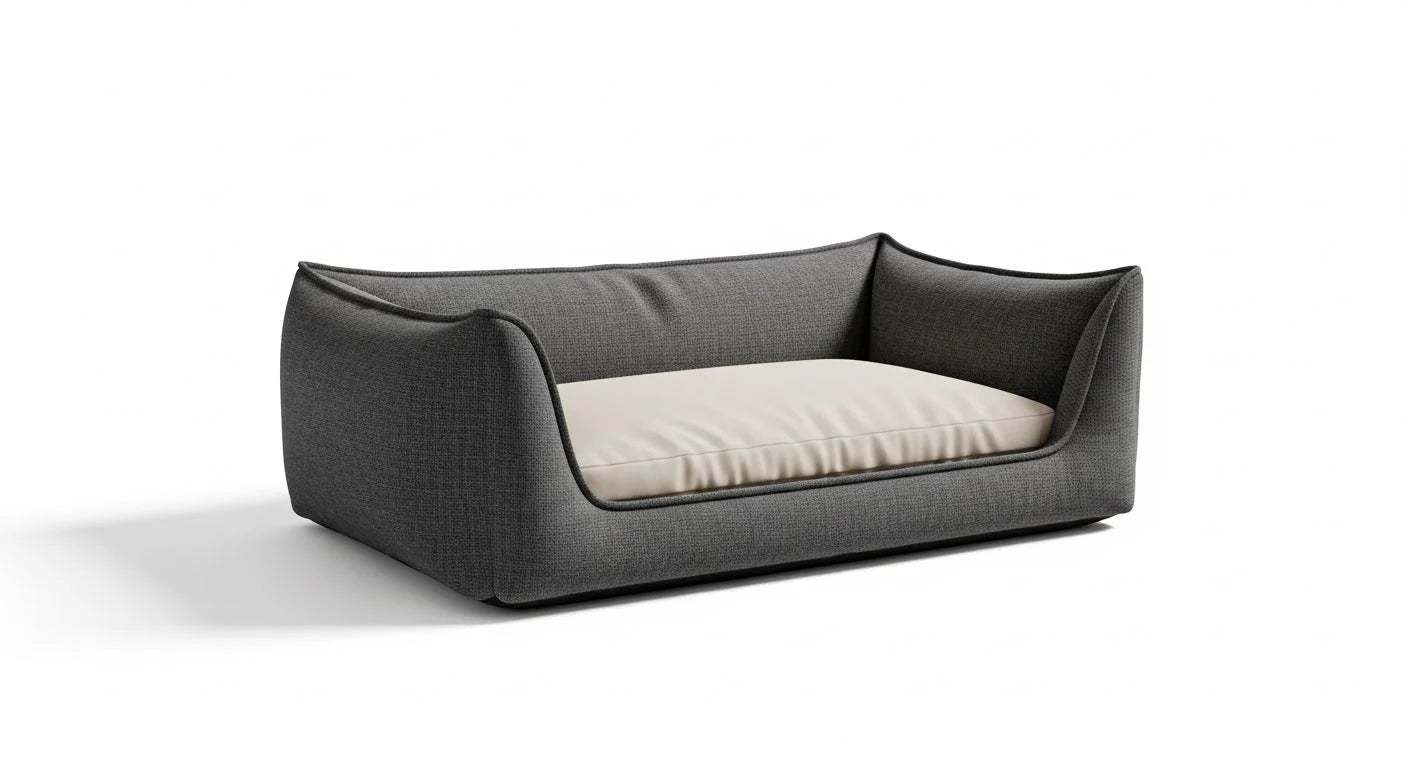 A dark gray fabric dog bed with a cream-colored cushion and black trim on a white background.
